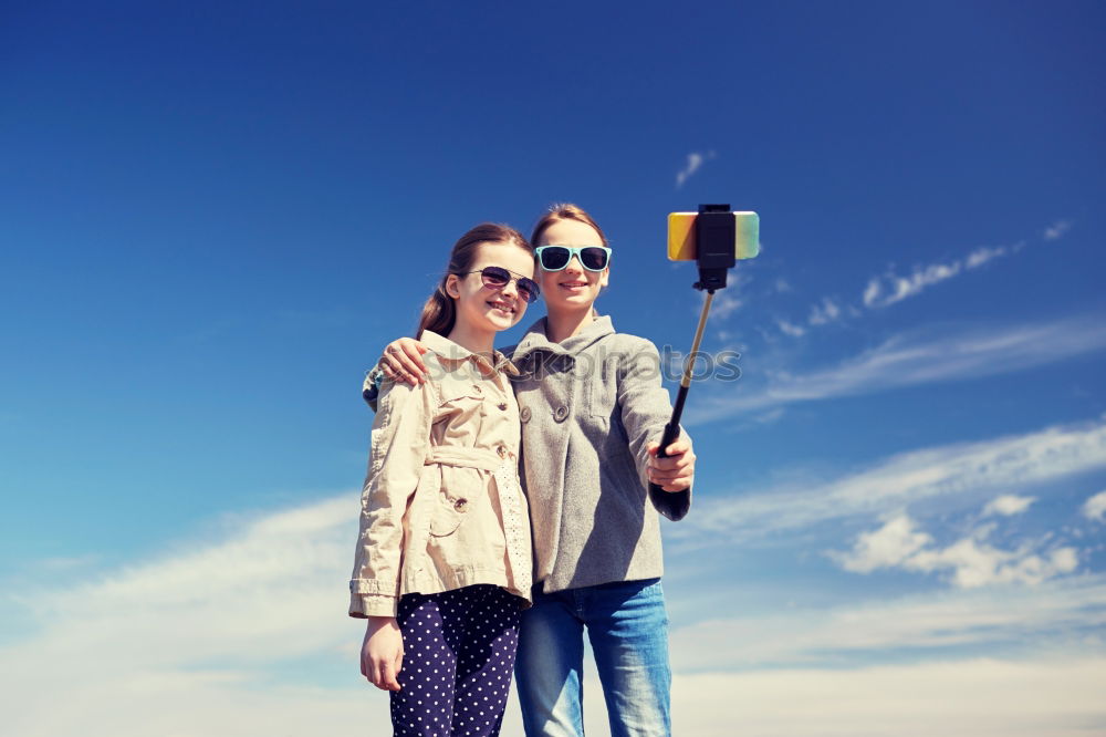 Similar – Father and daughter walking on the road at the day time.