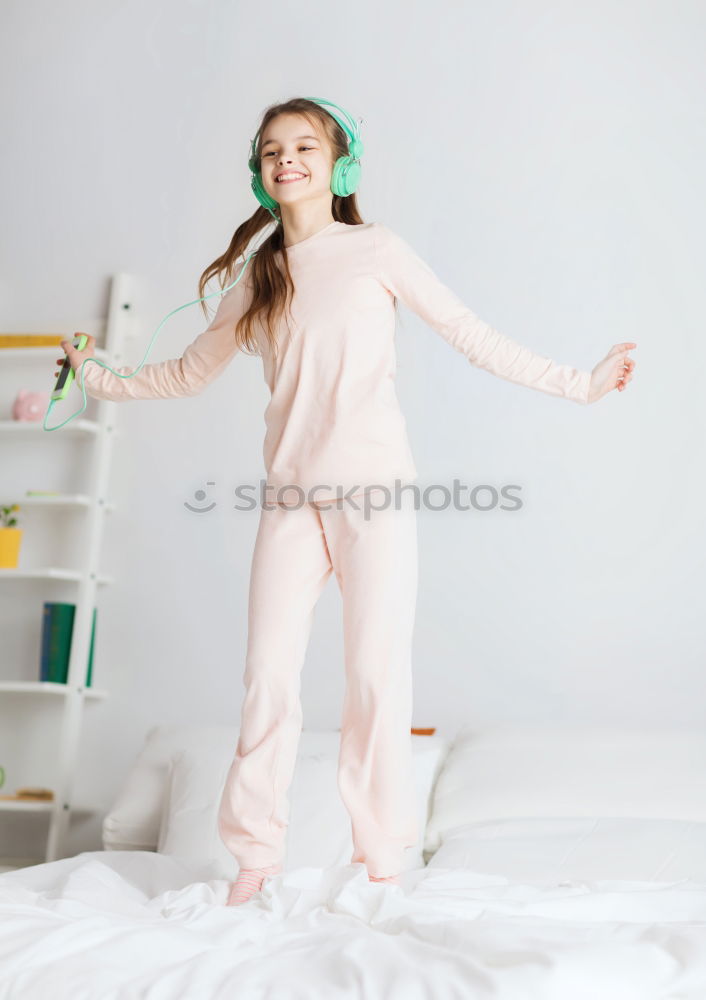 Similar – beautiful kid girl jumping on bed