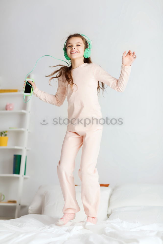 Similar – beautiful kid girl jumping on bed