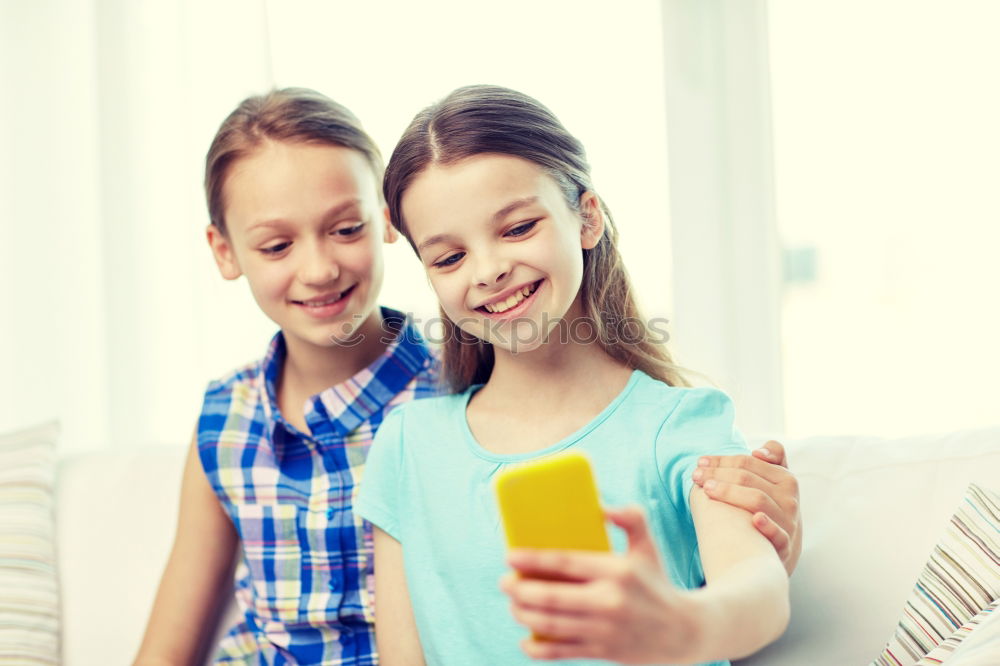 Similar – Young happy couple using smart phone sitting in the park