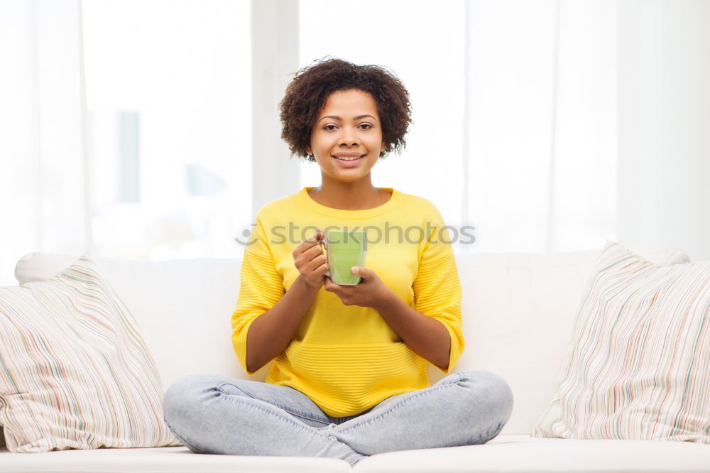 Similar – black woman reading on a sofa