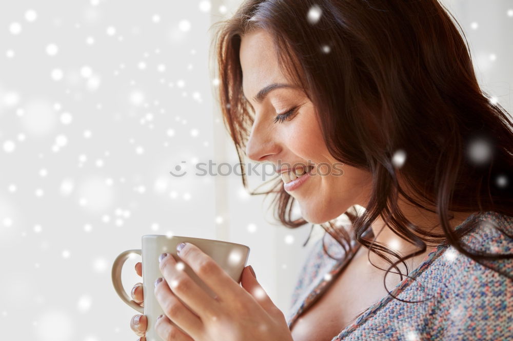 Similar – Young woman holding warm cup of tea