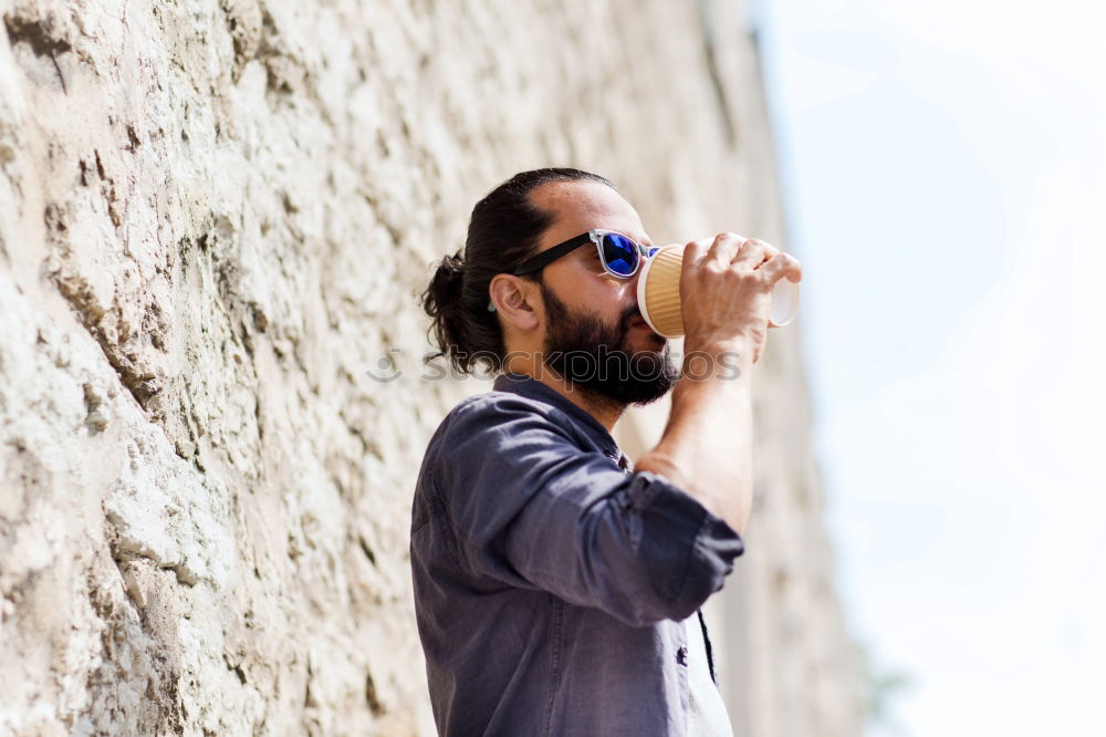 Cheerful bearded man with headphones