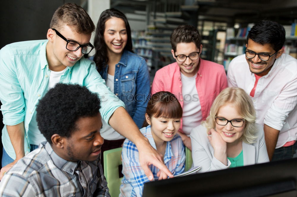 Similar – Image, Stock Photo Multiracial young people looking at a tablet computer