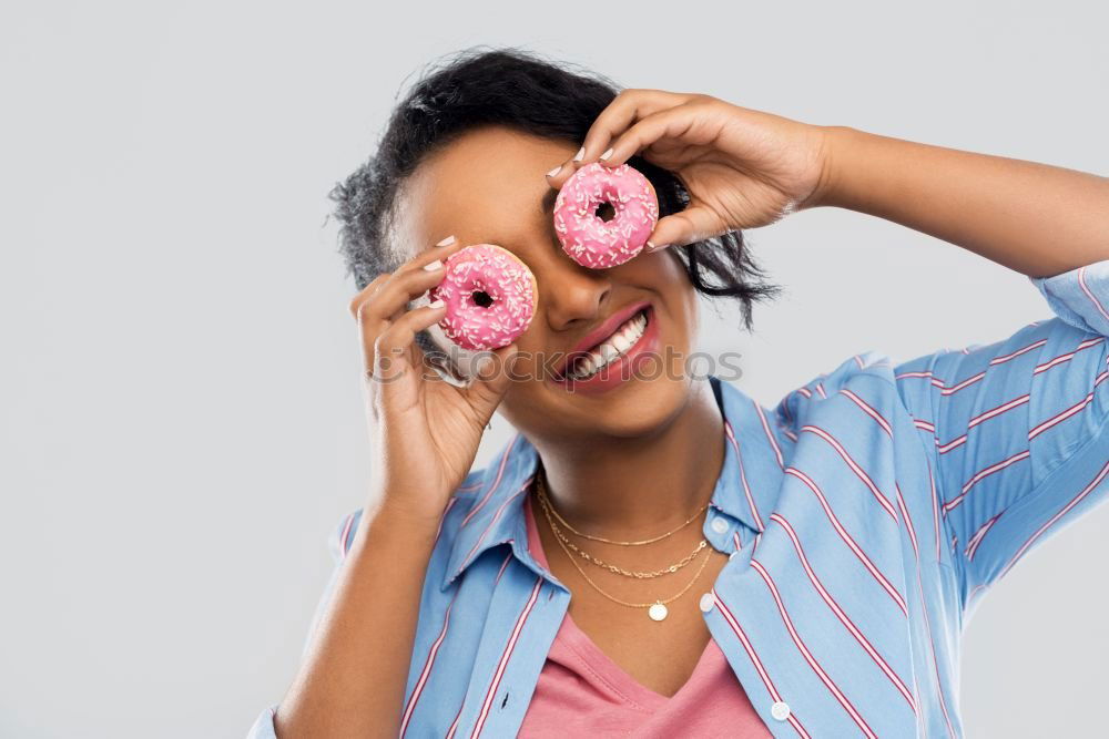 Image, Stock Photo Caucasian women making funny face with chocolate donuts