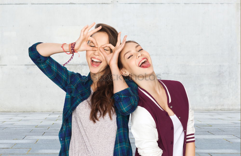 Similar – Image, Stock Photo Young adult hipster girlfriends taking selfie and pulling faces