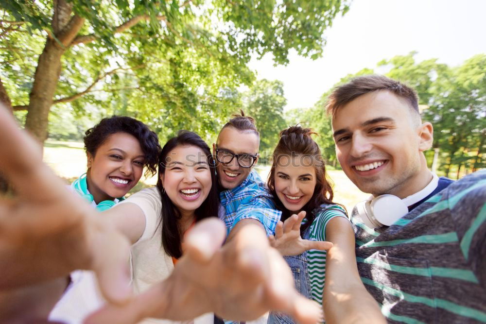 Similar – Image, Stock Photo Multiracial group of friends taking selfie in a urban street with a blonde woman in foreground