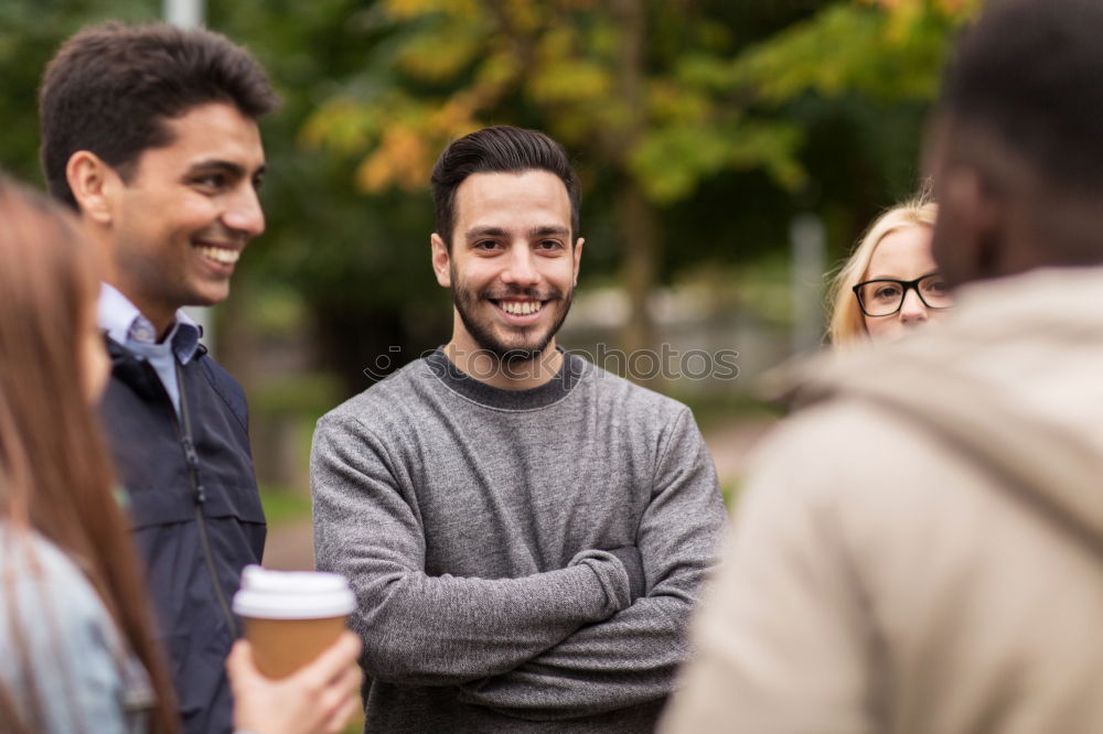 Similar – Multiracial group of three friends having a coffee together