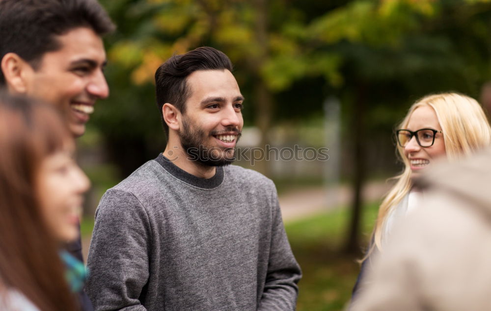 Similar – Multiracial group of three friends having a coffee together