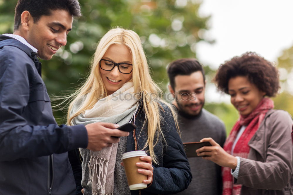 Similar – Multi-ethnic group of people looking at a tablet computer