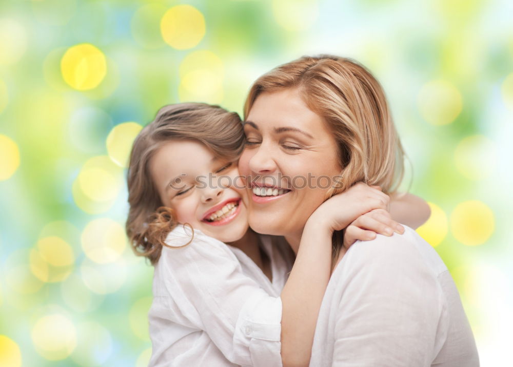 Similar – Image, Stock Photo Young happy mother embraced her cute little girl at canola field