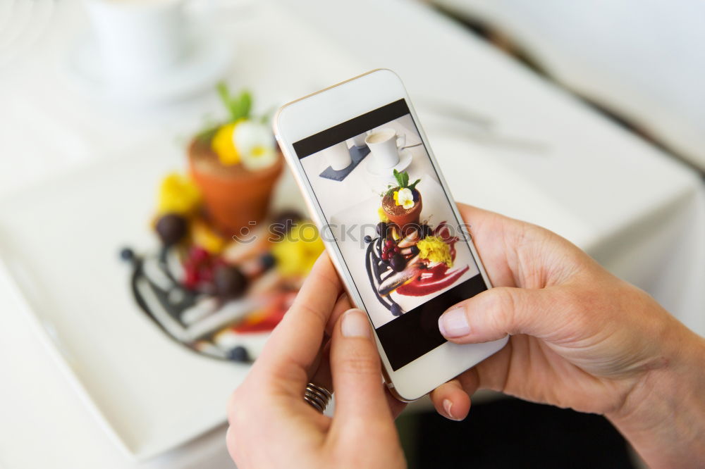 Similar – Image, Stock Photo Hand with smartphone mobile phone, photo of Burger on table