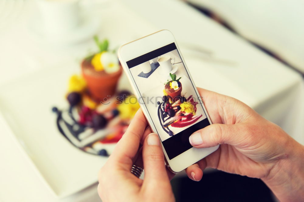 Similar – Image, Stock Photo Hand with smartphone mobile phone, photo of Burger on table