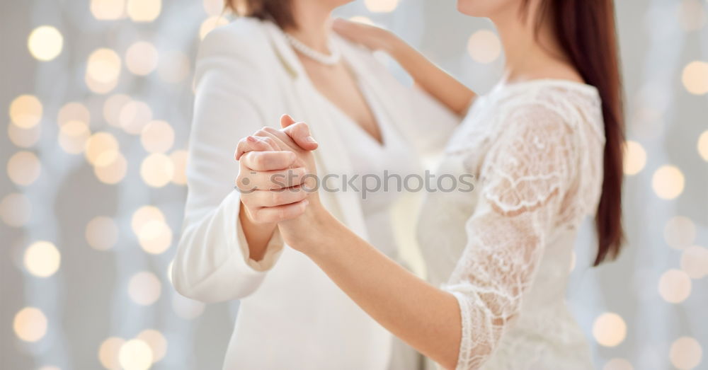 Similar – beautiful young woman with long flowing blond hair examines white wedding dress