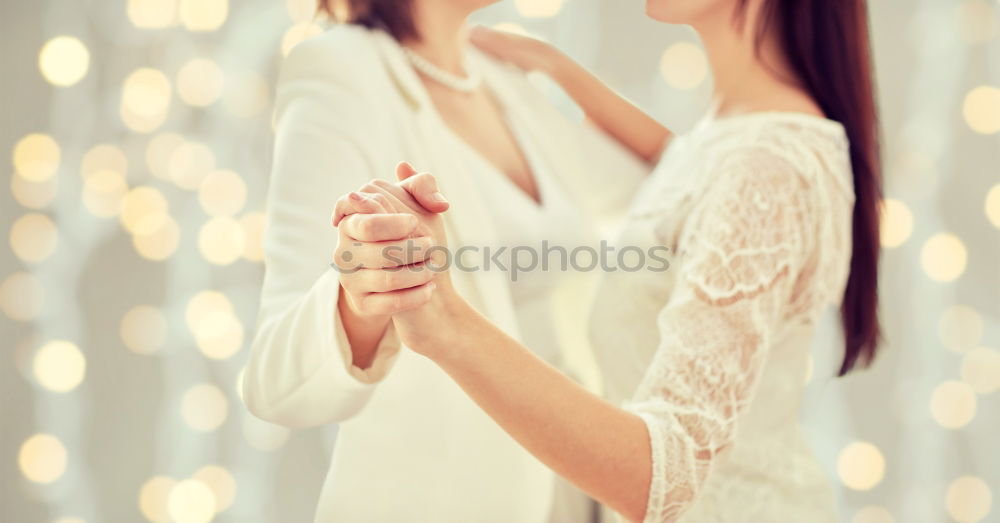 Similar – beautiful young woman with long flowing blond hair examines white wedding dress