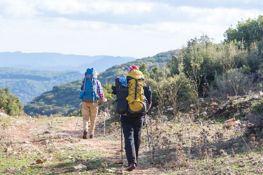 Similar – Image, Stock Photo Couple of hikers doing trekking