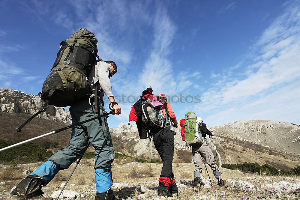 Similar – Four people with hiking backpacks, mountain landscape, Scandinavia