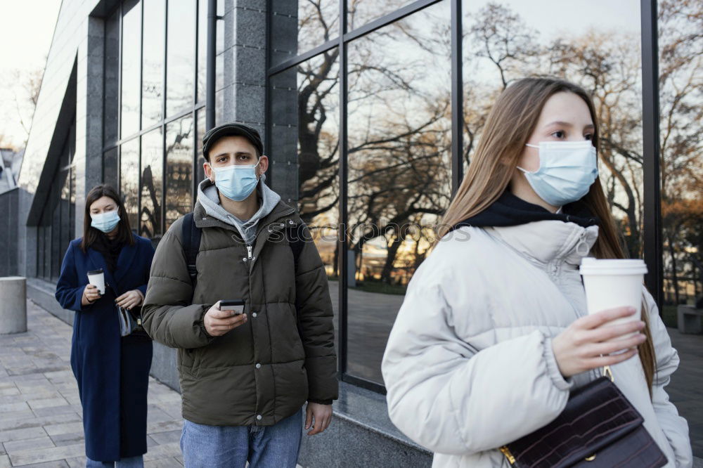 Similar – young woman wearing a mask and fogged glasses in autumn / winter (Corona / Covid-19)