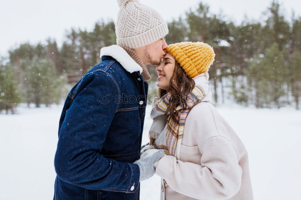 Similar – Image, Stock Photo romantic winter portrait of couple embracing in snowy forest