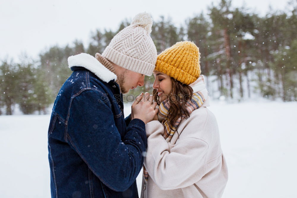 Similar – Image, Stock Photo romantic winter portrait of couple embracing in snowy forest