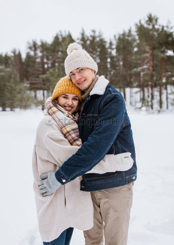 Similar – Couple having fun in winter forest