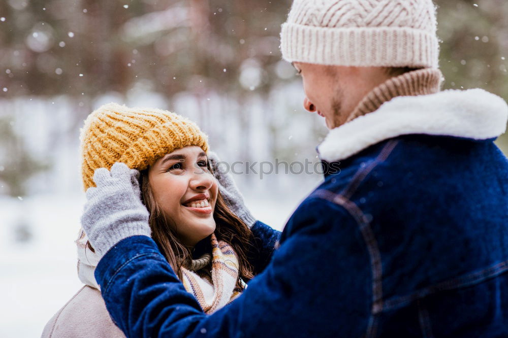 Similar – Young couple embracing under umbrella in a rainy day