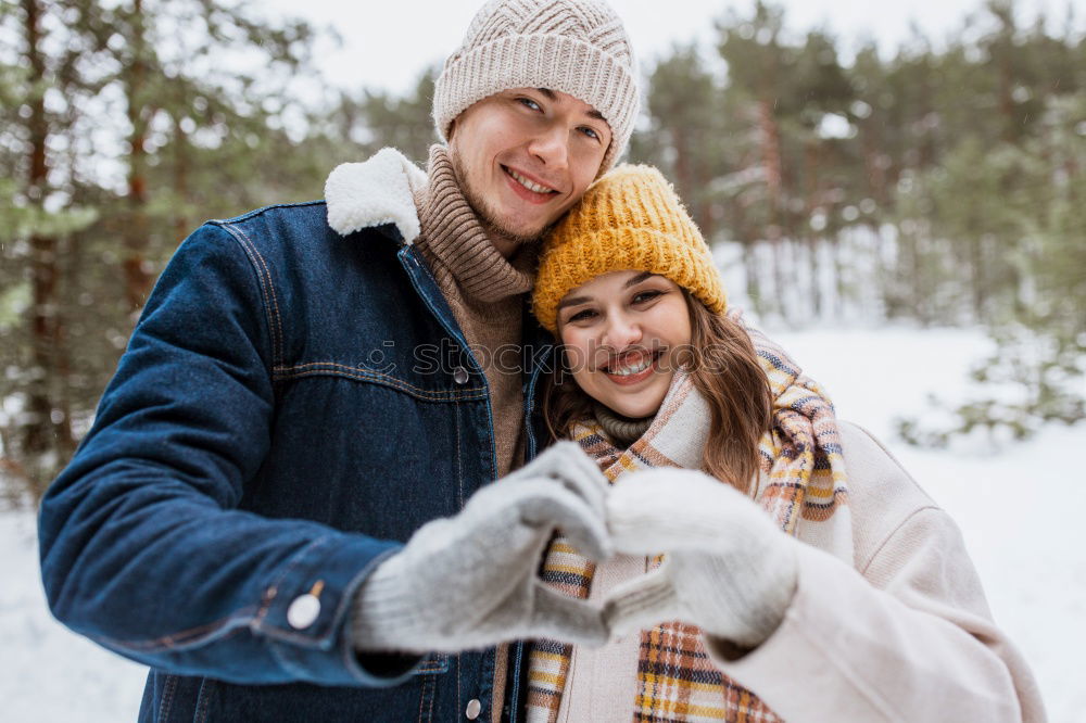 Similar – Image, Stock Photo Couple having fun in winter forest