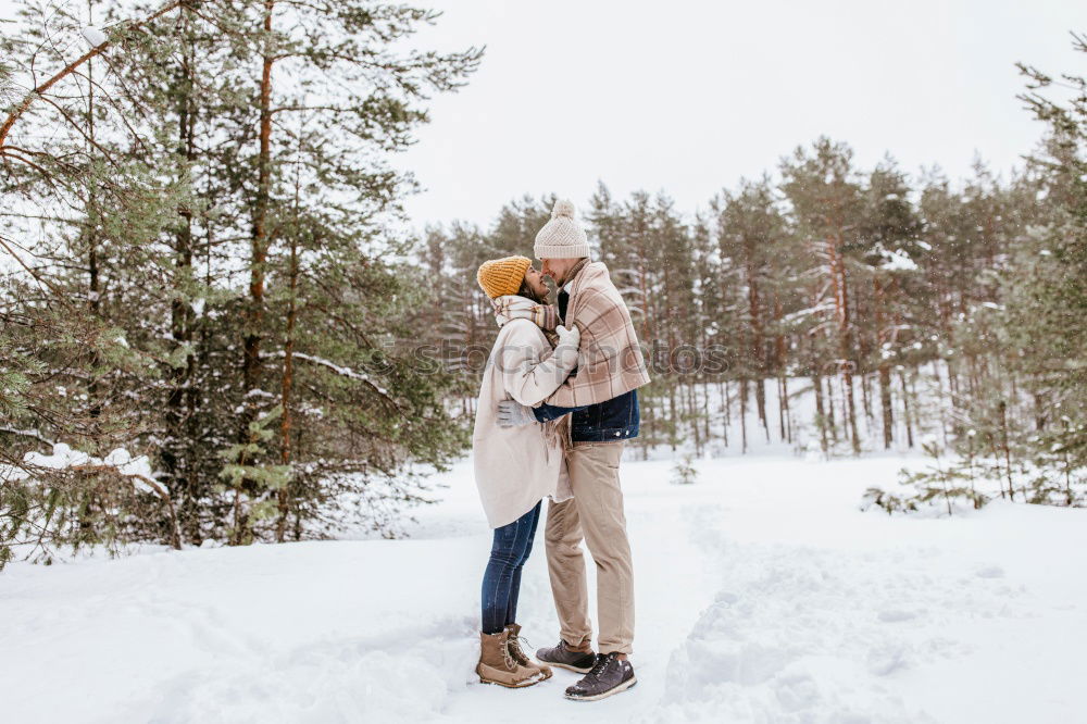 Similar – Couple having fun in winter forest