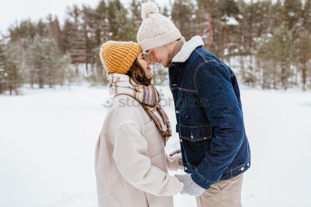 Similar – Image, Stock Photo romantic winter portrait of couple embracing in snowy forest