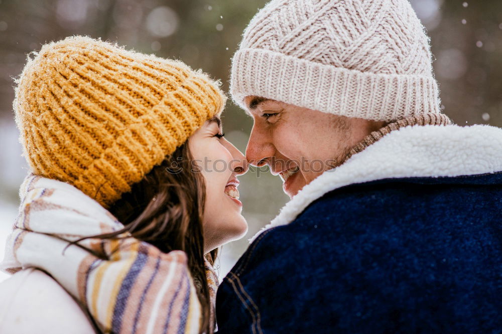 Similar – Young couple looking at each other under umbrella outdoors