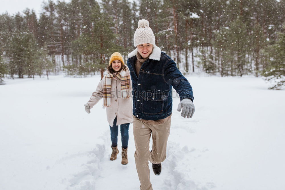 Similar – Image, Stock Photo Lifestyle winter portrait of romantic couple walking