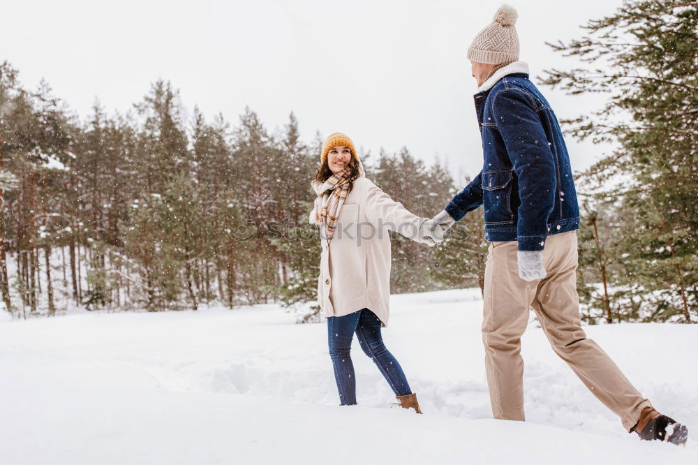 Similar – Image, Stock Photo Lifestyle winter portrait of romantic couple walking