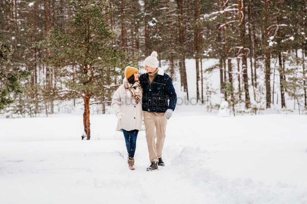 Similar – Lifestyle winter portrait of romantic couple walking