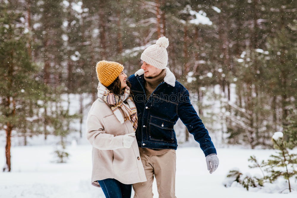 Similar – Image, Stock Photo Couple having fun in winter forest