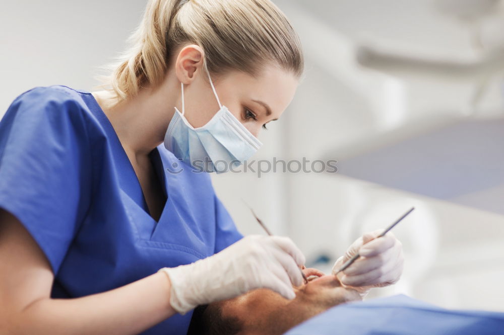 Similar – Doctor holding syringe with vaccine and making injection to senior patient. Covid-19 or coronavirus vaccine