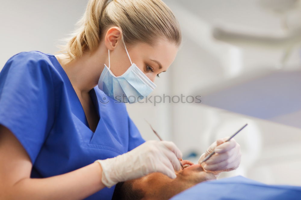 Similar – Doctor holding syringe with vaccine and making injection to senior patient. Covid-19 or coronavirus vaccine