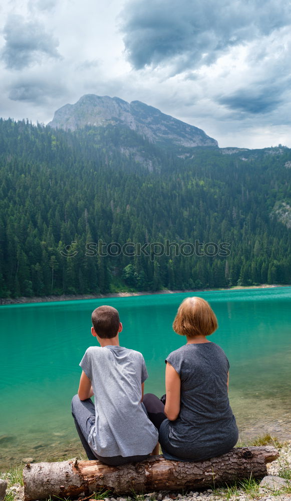 Similar – Image, Stock Photo Women sitting at lake