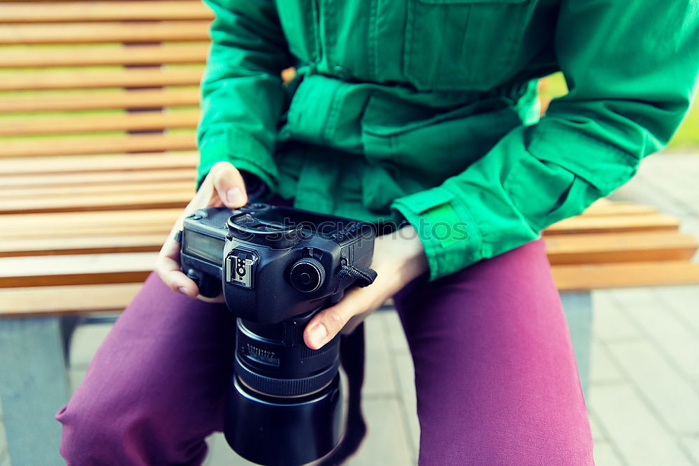 Similar – Close up of a photographer with her camera.