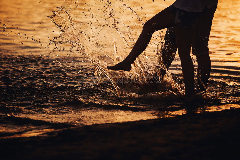 Similar – Crop couple posing in sand