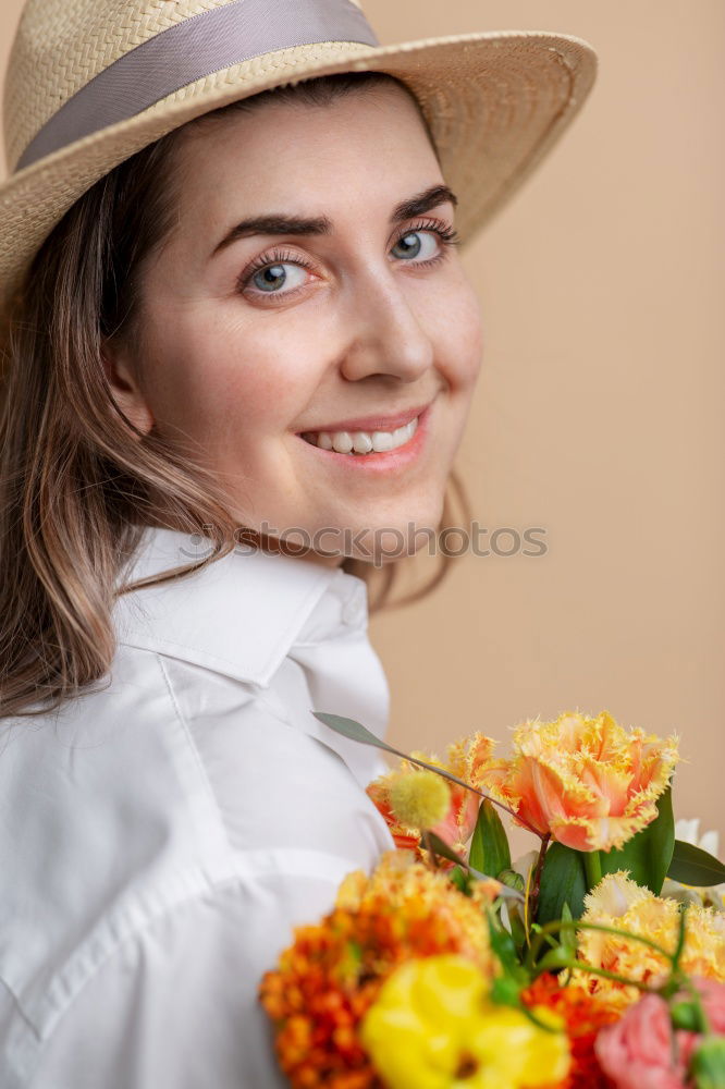 Similar – Pretty woman standing with white flowers