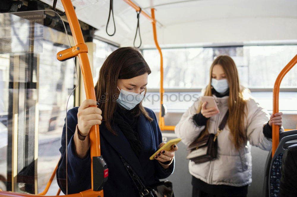 Similar – Image, Stock Photo Young woman with face mask and dog traveling by train.Train travel during pandemic