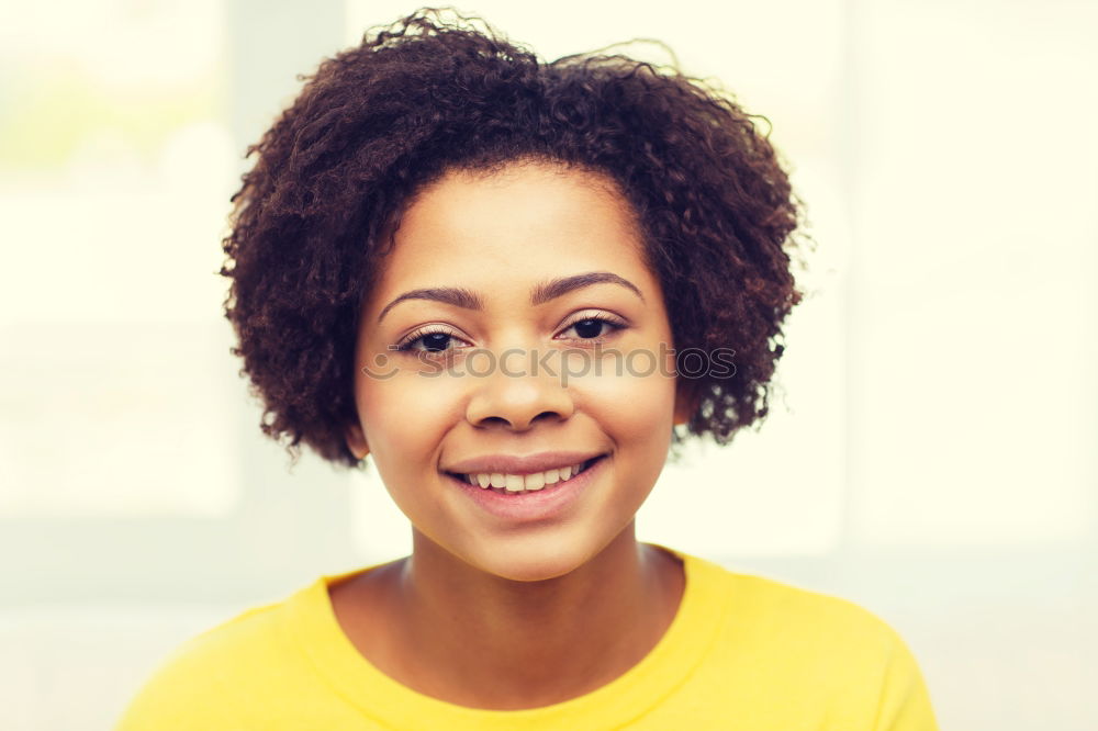 Beautiful African girl with curly hair on the rooftop