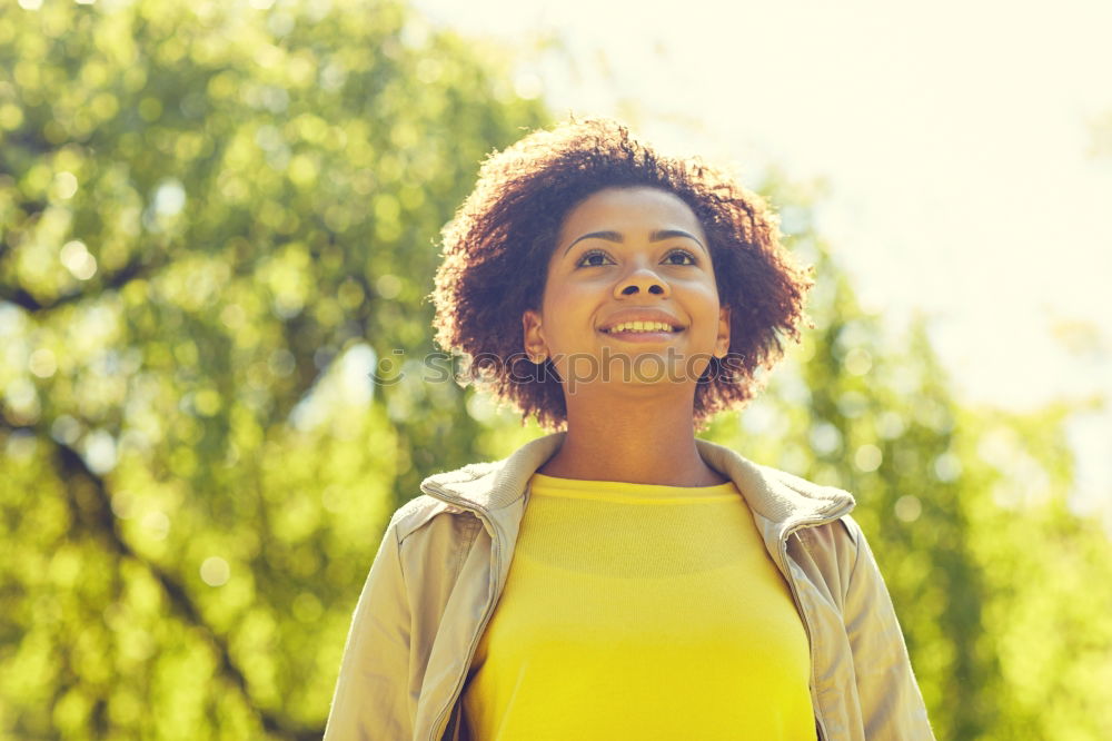 Similar – Image, Stock Photo Young black woman, afro hairstyle, sitting on a wall smiling