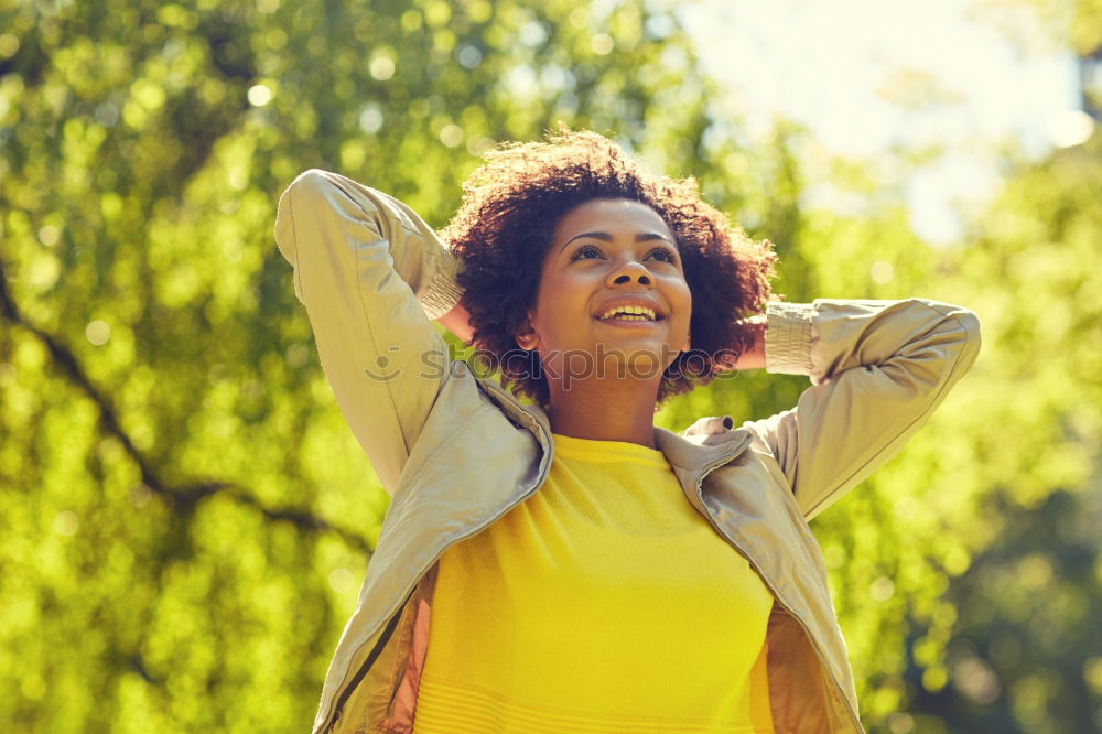 Similar – Image, Stock Photo Young black woman, afro hairstyle, sitting on a wall smiling