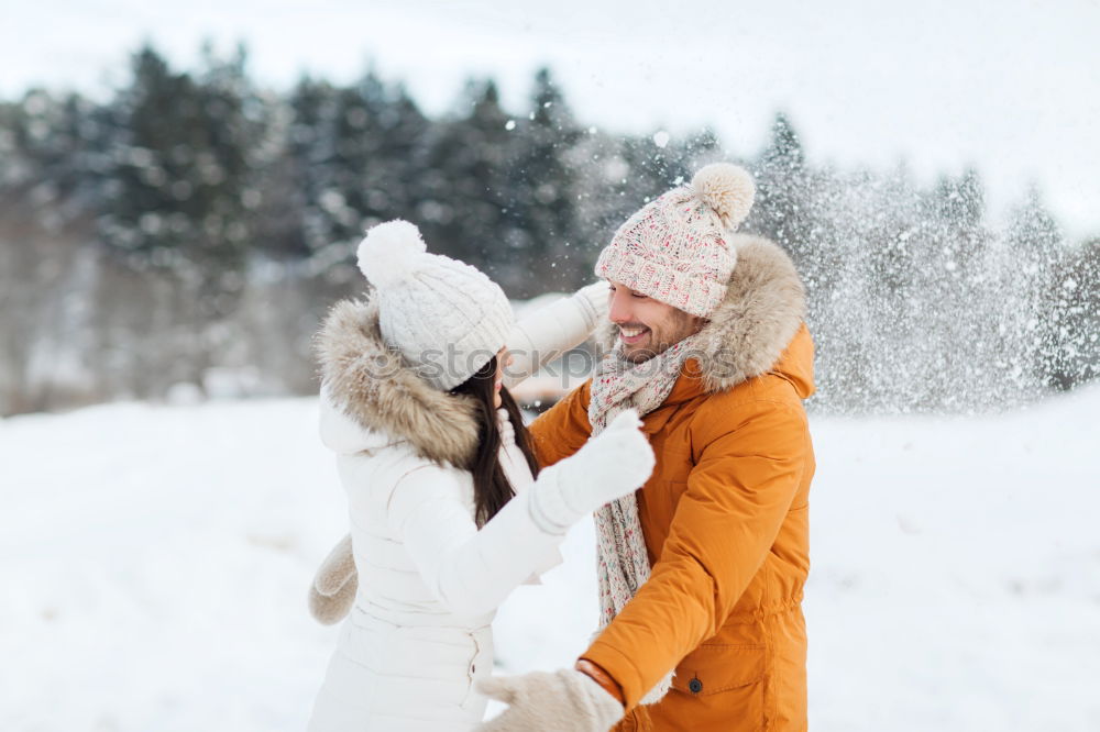 Similar – Friends playing snowballs in woods