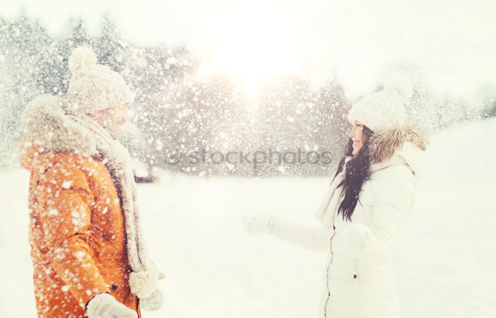 Similar – Friends playing snowballs in woods