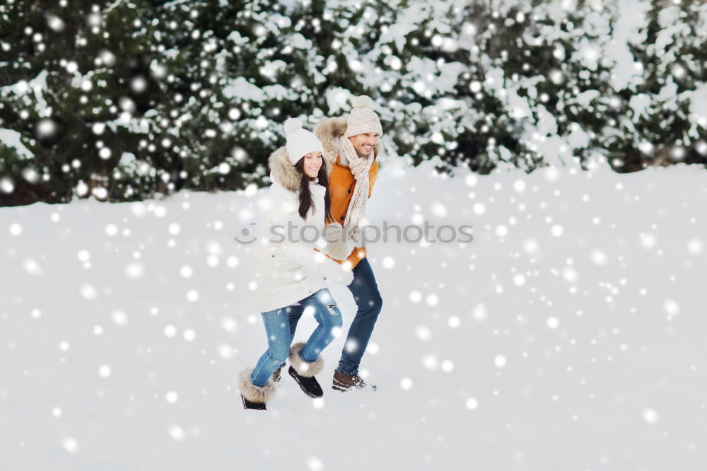 Similar – Lifestyle winter portrait of romantic couple walking