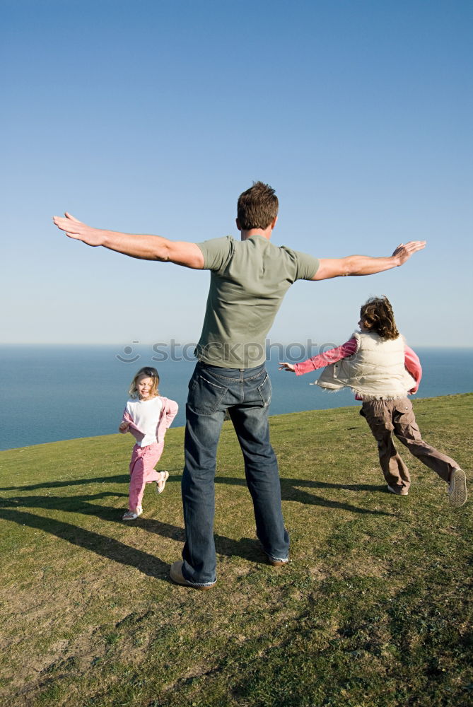 Similar – Image, Stock Photo Father and son standing on the road at the day time. Concept of tourism.