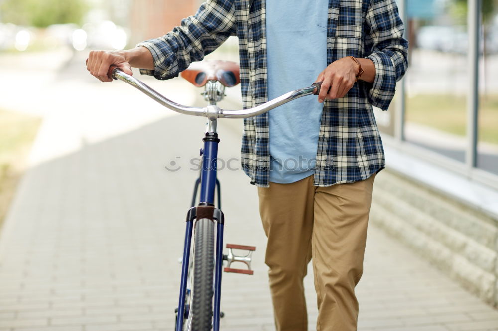 Similar – Man in the street wearing suit near a vintage bicycle.