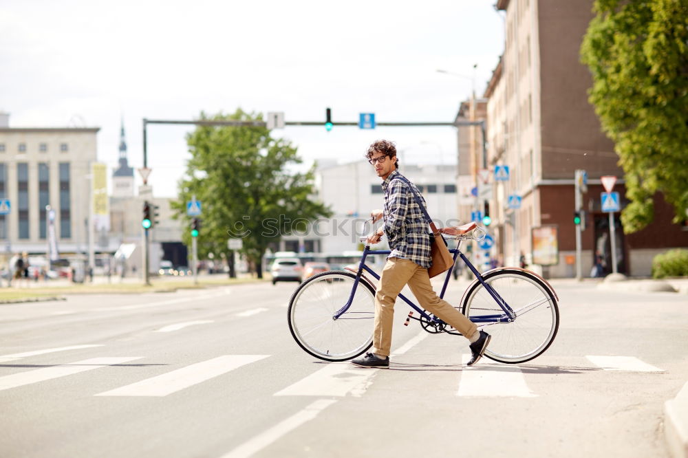 Similar – Happy family with a child riding bicycles by the city